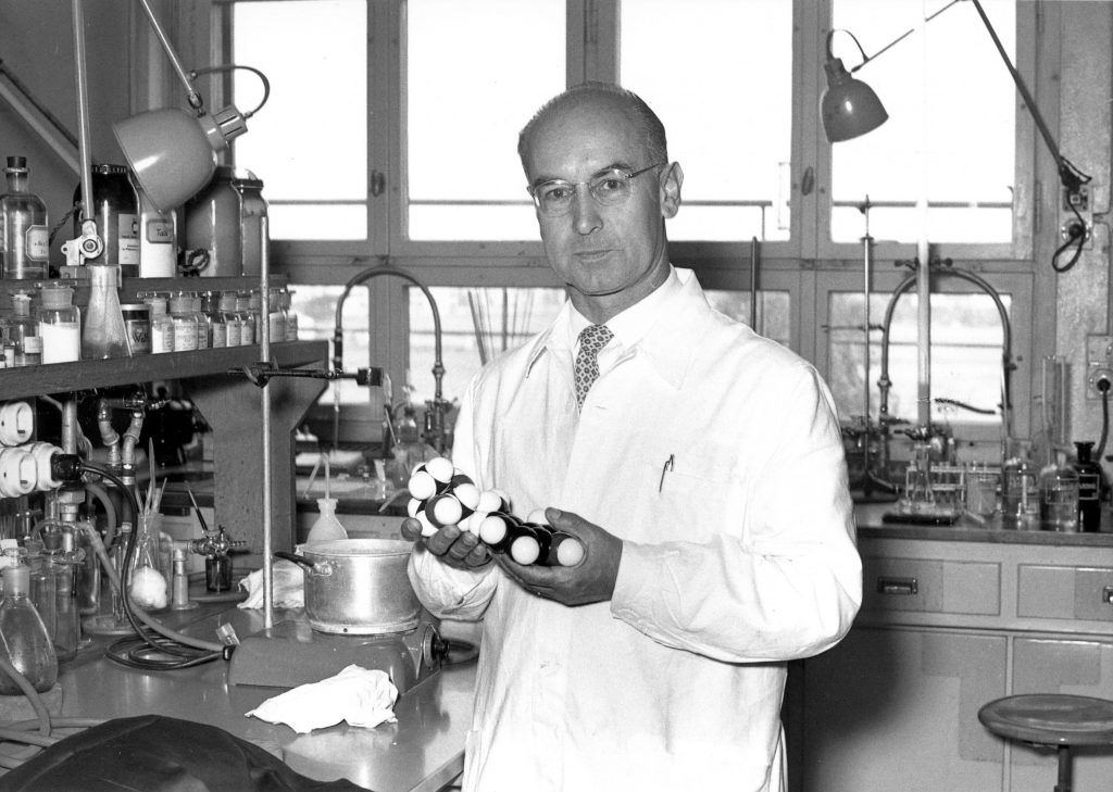 Albert Hofmann holding an LSD molecule model - Synergetic Press