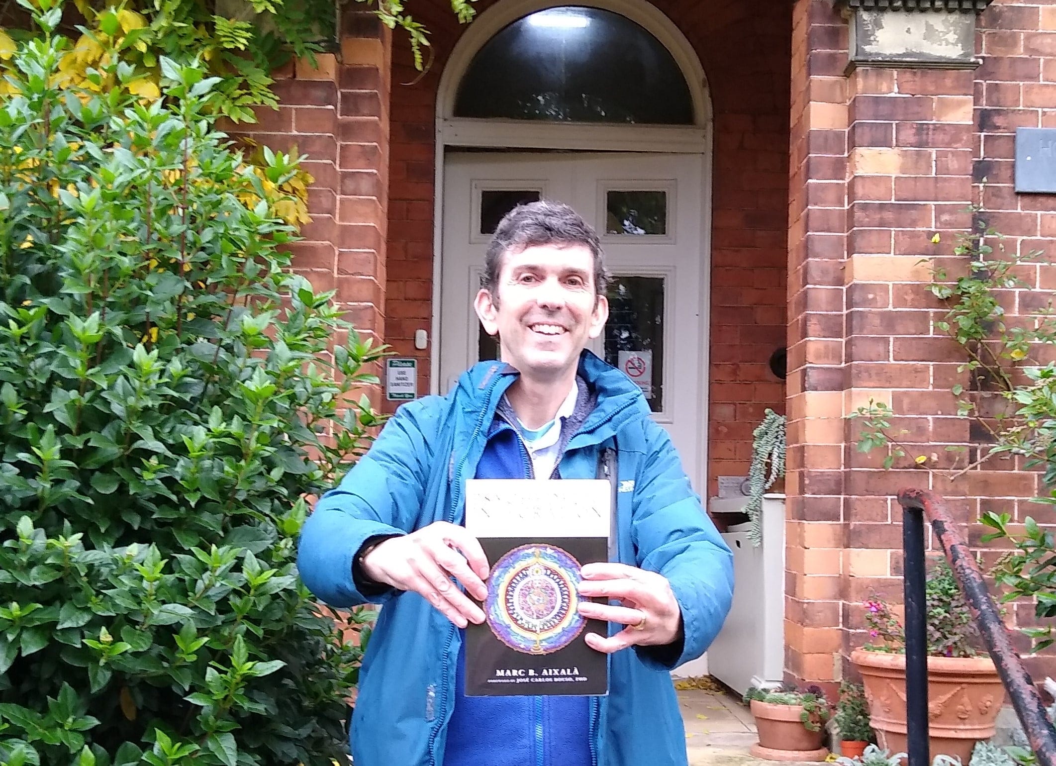John Ablett holding a copy of Psychedelic Integration